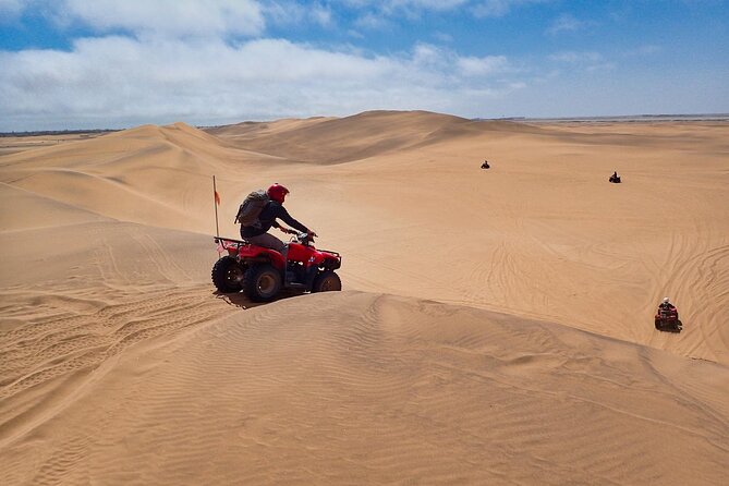 3-Hour Quad Biking and Sand-Boarding Combo from Swakopmund - Riding a quad bike across the Namib dunes