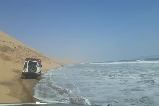 Exhilarating Sandwich Harbour 4x4: Guided Self drive experience - Flamingos and pelicans at the Walvis Bay wetland