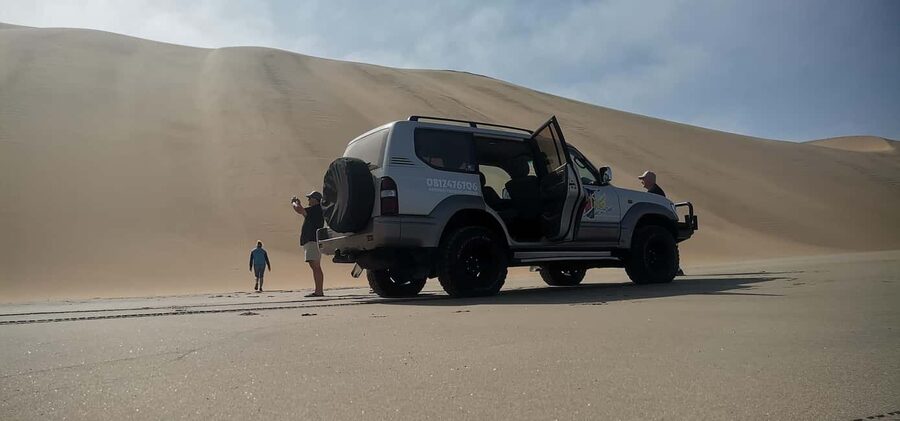 swakopmund city tour dune 7 pink lake pink flamingos - Dune 7 is the tour’s big visual moment