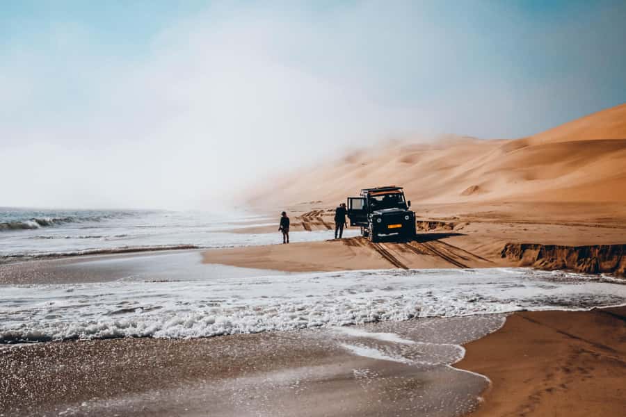Walvis Bay: Dolphin Cruise, Pink Lakes and 4x4 Dune Drive - Entering Sandwich Harbour by 4x4